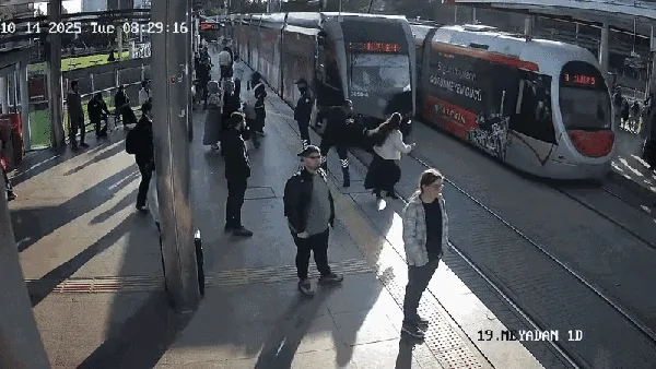 woman-distracted-by-earphones-narrowly-escapes-being-hit-by-train-in-turkey