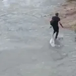 homens-enfrentam-correnteza-e-se-arriscam-no-corrego-da-marginal-botafogo,-em-goiania