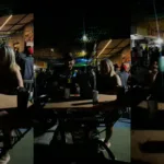 casal-improvisa-mesa-na-lixeira-para-acompanhar-jogo-do-brasil-em-festa-de-rua-no-garavelo:-“virou-um-bistro”