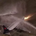 entenda-por-que-caminhoes-de-bombeiro-jogaram-agua-no-aviao-da-selecao-brasileira