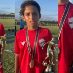 João Miguel Vila Nova com taça de artilheiro do Goianão Sub-11