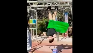 artista-chines-quebra-recorde-ao-equilibrar-33-bamboles-suspenso-de-ponta-cabeca