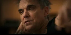 cantor-robbie-williams-revela-diagnostico-de-autismo-e-encontra-alivio-em-nova-perspectiva