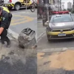 agentes-de-transito-usam-serragem-para-cobrir-oleo-derramado-na-rua-4,-em-goiania;-video